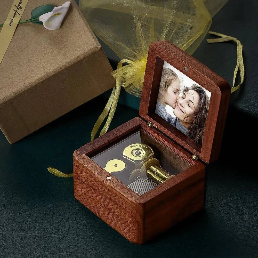 Personalized wooden music box by MadeMine, vintage romantic keepsake with engraved photo display and musical mechanism.