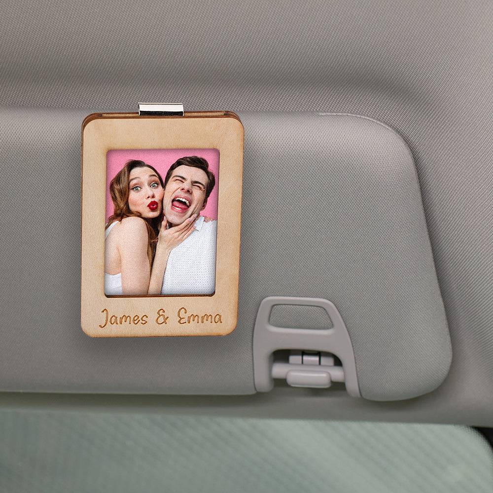 Personalized MadeMine car sun visor clip with magnetic photo frame, showing a custom photo display on a vehicle's sun visor.