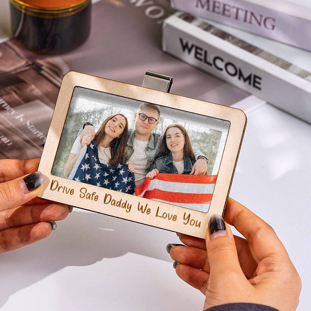 MadeMine personalized photo car sun visor clip with magnetic frame, showcasing a custom picture attached to a vehicle's sun visor.