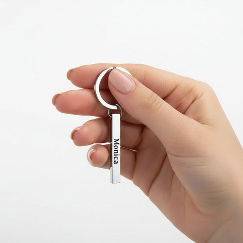 Custom Spotify code bar keychain by MadeMine featuring 3D engraved music note design on a silver key chain.