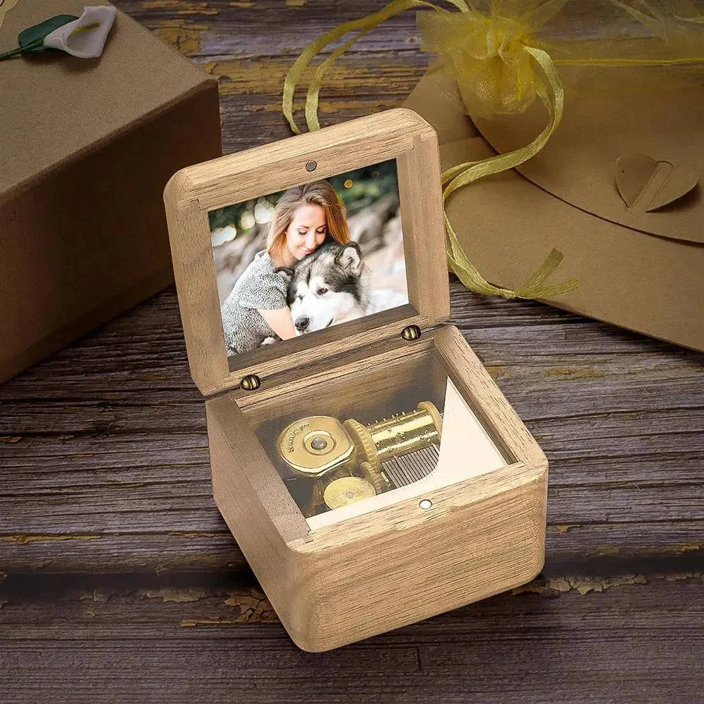 Personalized wooden music box with vintage design, featuring a romantic scene and space for a custom photo, made by MadeMine.