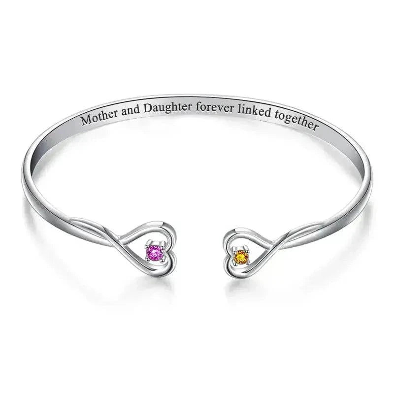 Custom double birthstone bracelet by MadeMine featuring personalized two-stone jewelry with colorful gemstone accents.