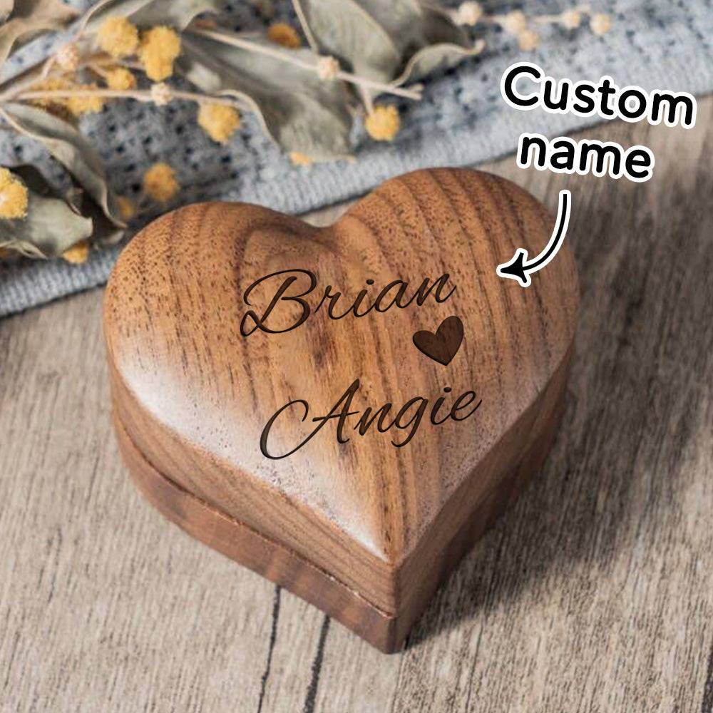 Personalized wooden heart-shaped ring box by MadeMine, perfect for proposals and engagement gifts, with engraved details visible.