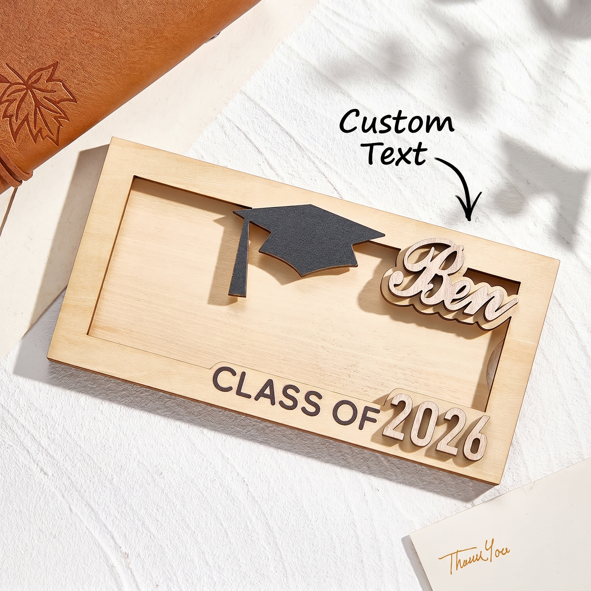 Wooden plaque with graduation cap, 'Ben', and 'Class of 2024' text on a white background