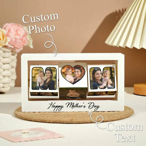MadeMine custom rotating photo cube frame showing 360° display stand with multiple photo slots on a sleek black background.