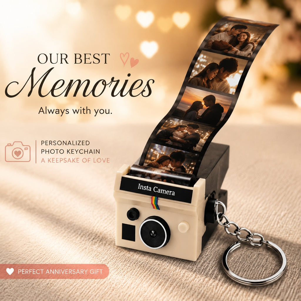 Personalized photo keychain shaped like an instant camera, shown with a printed film strip of couple photos. The cream-colored camera body has a black label reading 'Insta Camera' and is attached to a silver key ring.