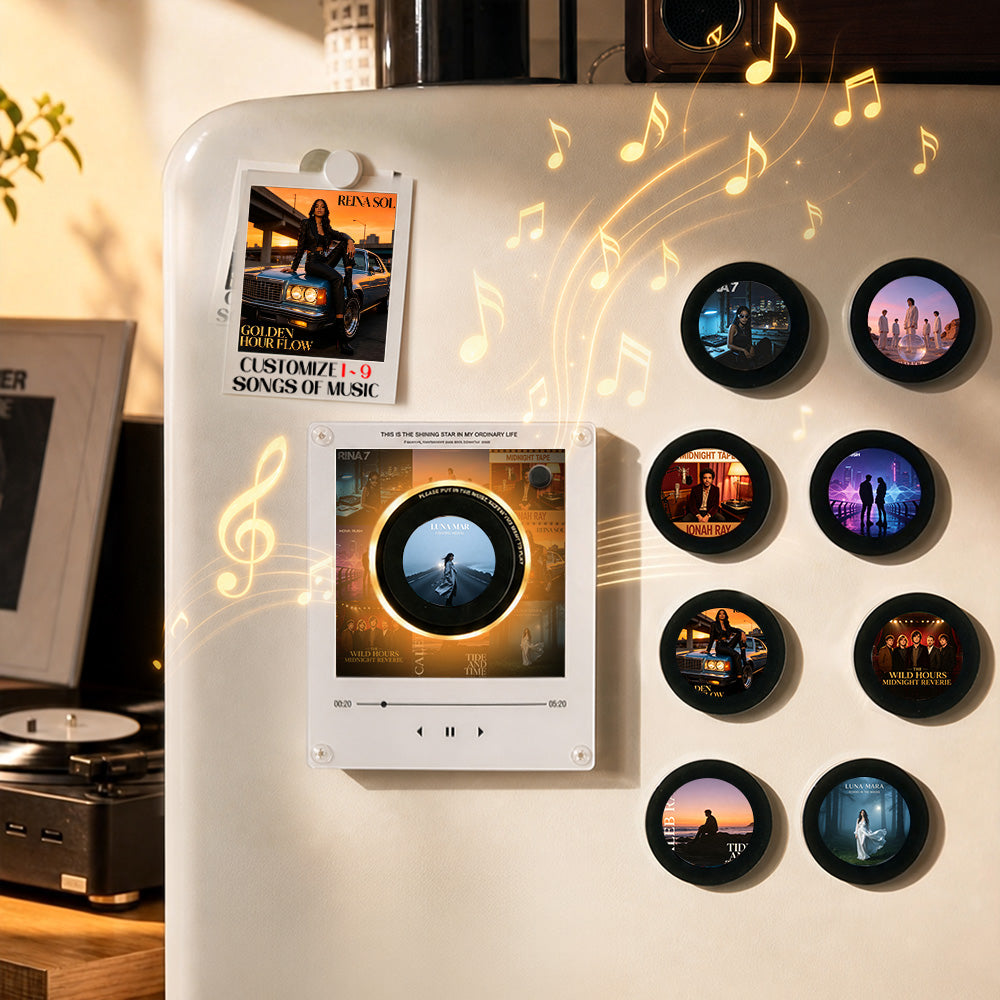 A white refrigerator door displays a custom music-themed magnet set. The set includes a central square magnet showing a music player interface with a circular album art, a smaller vertical photo magnet, and eight round black-framed magnets on the right side, each displaying different music-themed images.