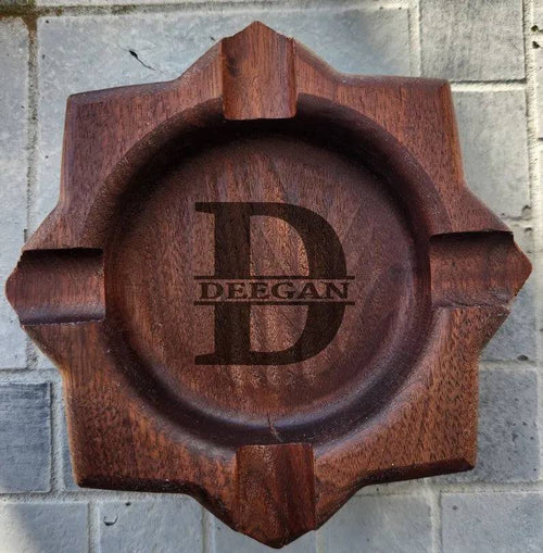 Personalized wooden cigar ashtray made of walnut with custom engraving, designed for cigar enthusiasts.