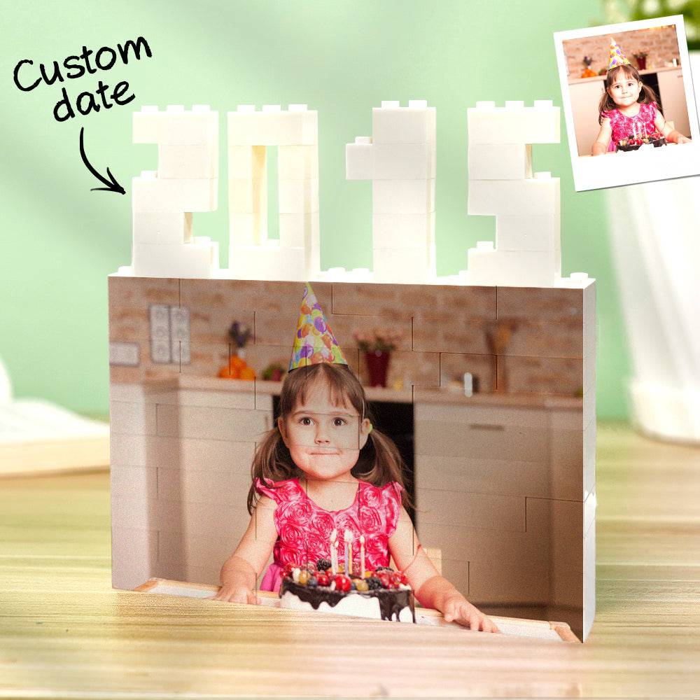 Personalized MadeMine photo brick puzzle featuring custom building blocks with a year, showcasing colorful interlocking puzzle pieces.