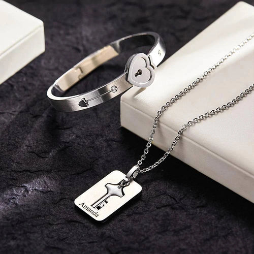 Custom engraved lock bracelet and key necklace set from MadeMine, featuring intricate jewelry design and personalized engraving.