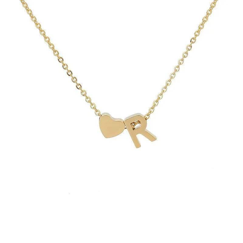 MadeMine tiny heart initial necklace with personalized pendant, ideal Mother's Day gift for mom or grandma, close-up of jewelry piece.