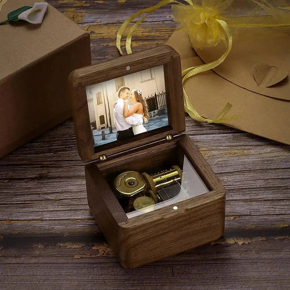 Personalized wooden music box by MadeMine featuring vintage design and romantic engraving, playing melodic tunes.