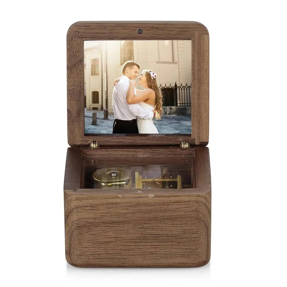 Personalized wooden music box with vintage design, featuring a romantic keepsake scene and customizable photo display from MadeMine.