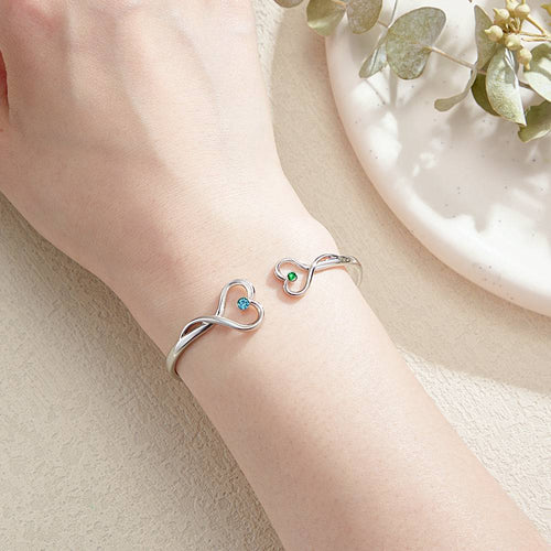 MadeMine custom double birthstone bracelet featuring two personalized stones on a delicate silver chain.