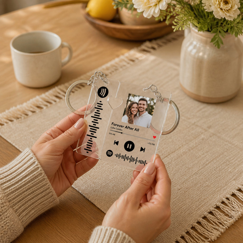 Scannable Spotify Keychain With Photo · Keychain in Hands at Kitchen Table